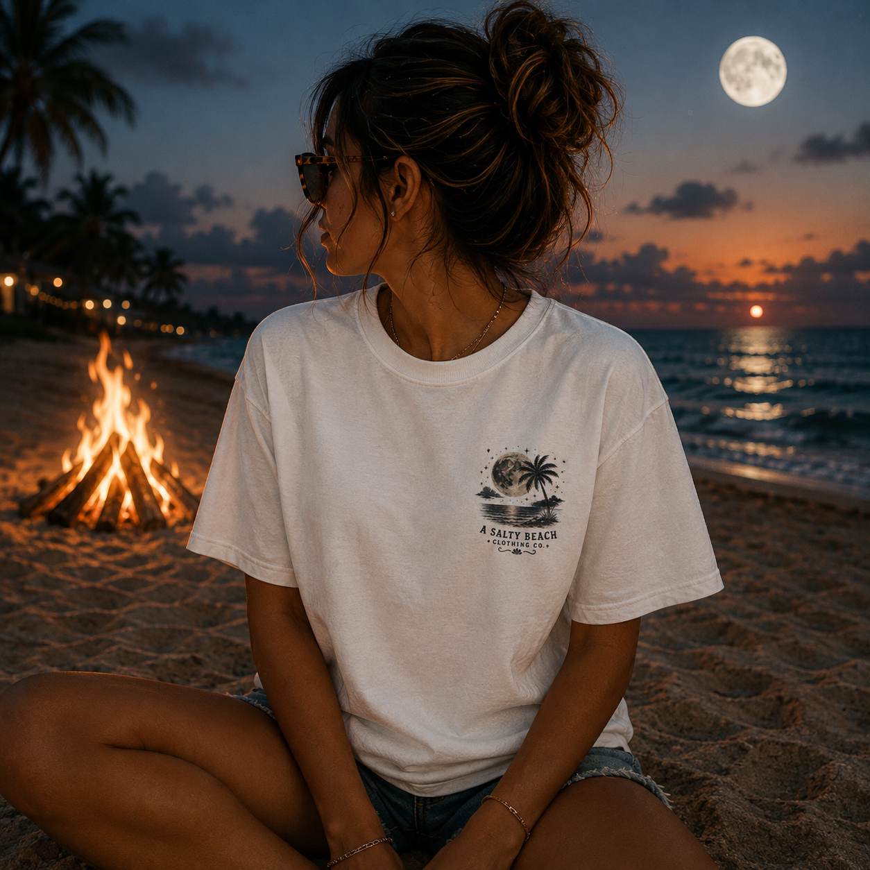 Front of cream Moonlight Saltwater & Ghost Stories graphic tee with A Salty Beach Clothing Co. pocket logo